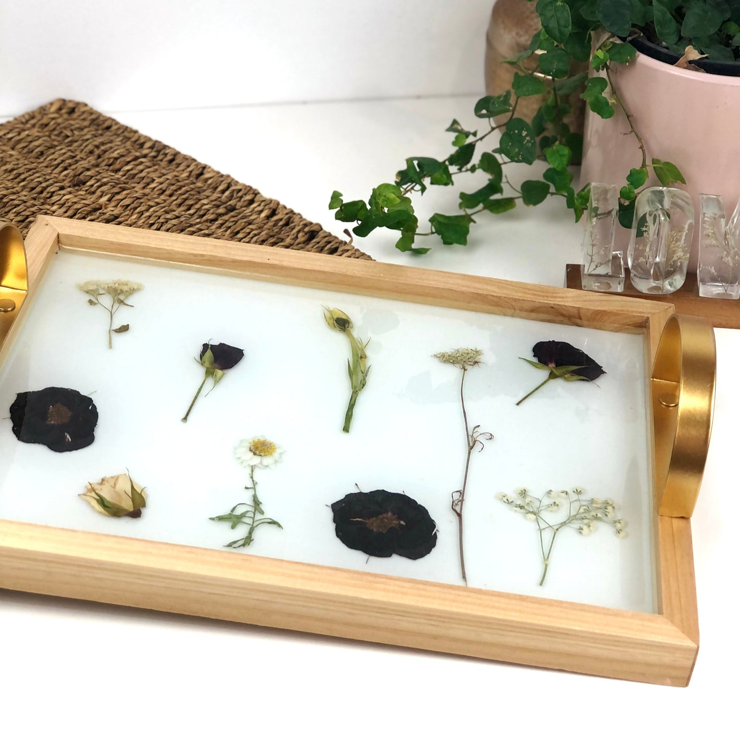 Wooden tray with gold handles.