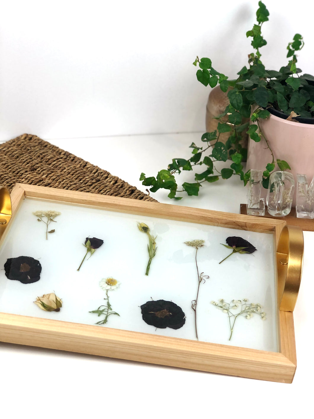 Wooden tray with gold handles.