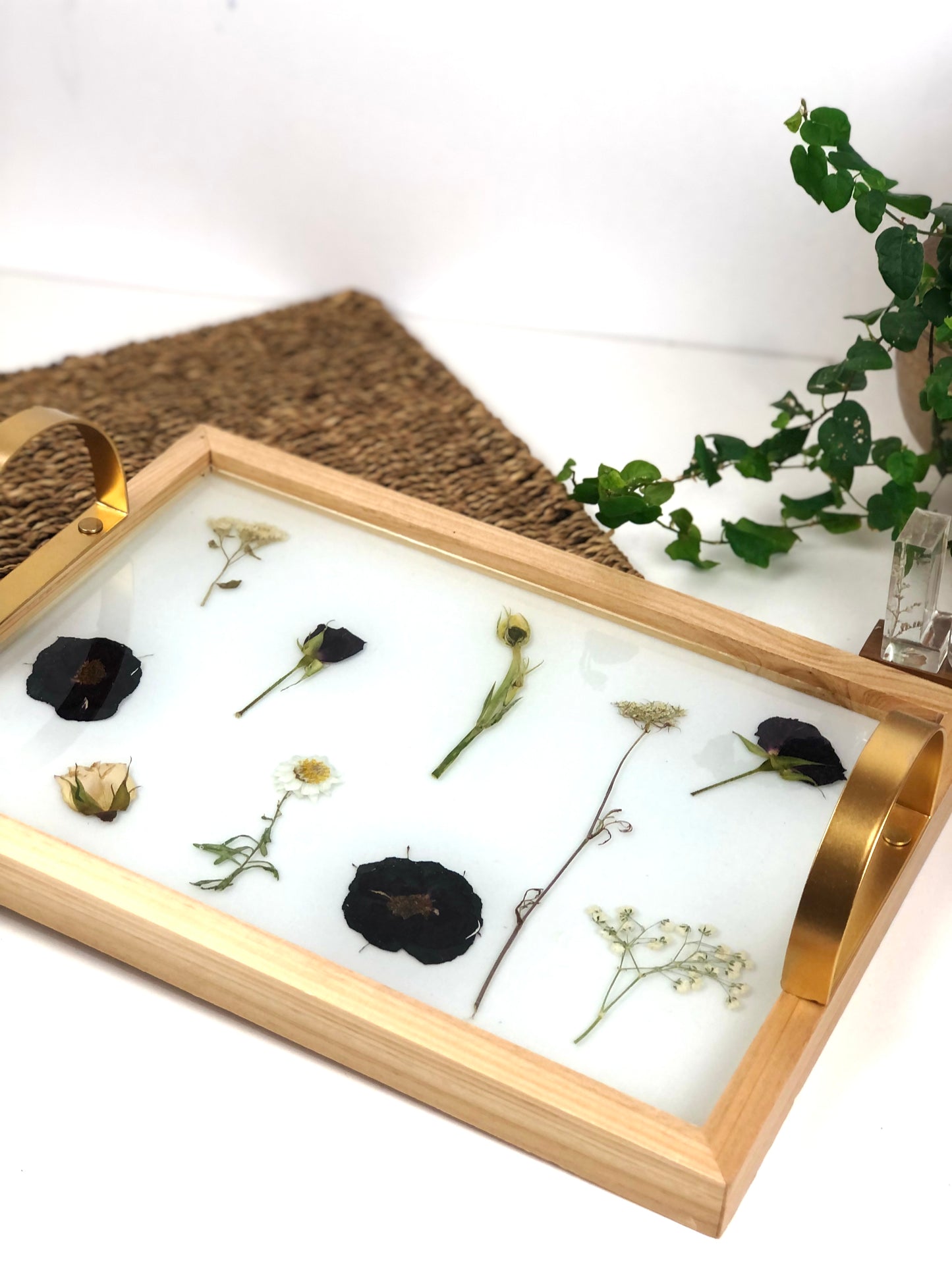 Wooden tray with gold handles.
